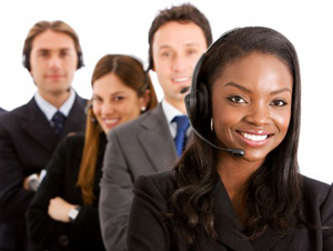 diverse call center agents grouped together with headsets