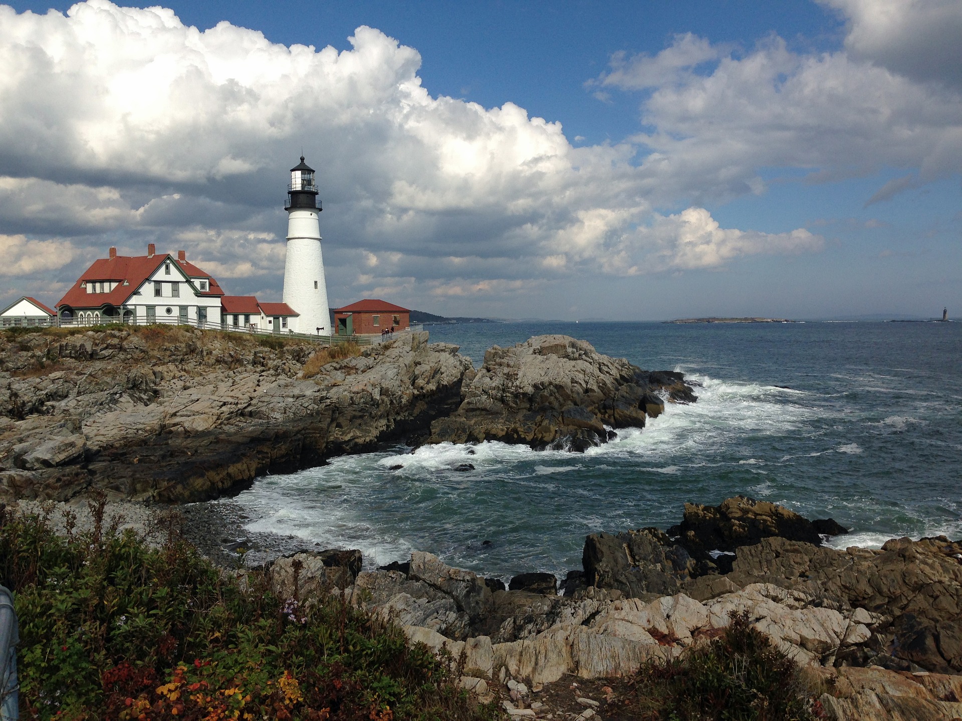 lighthouse on a rocky, ocean shore
