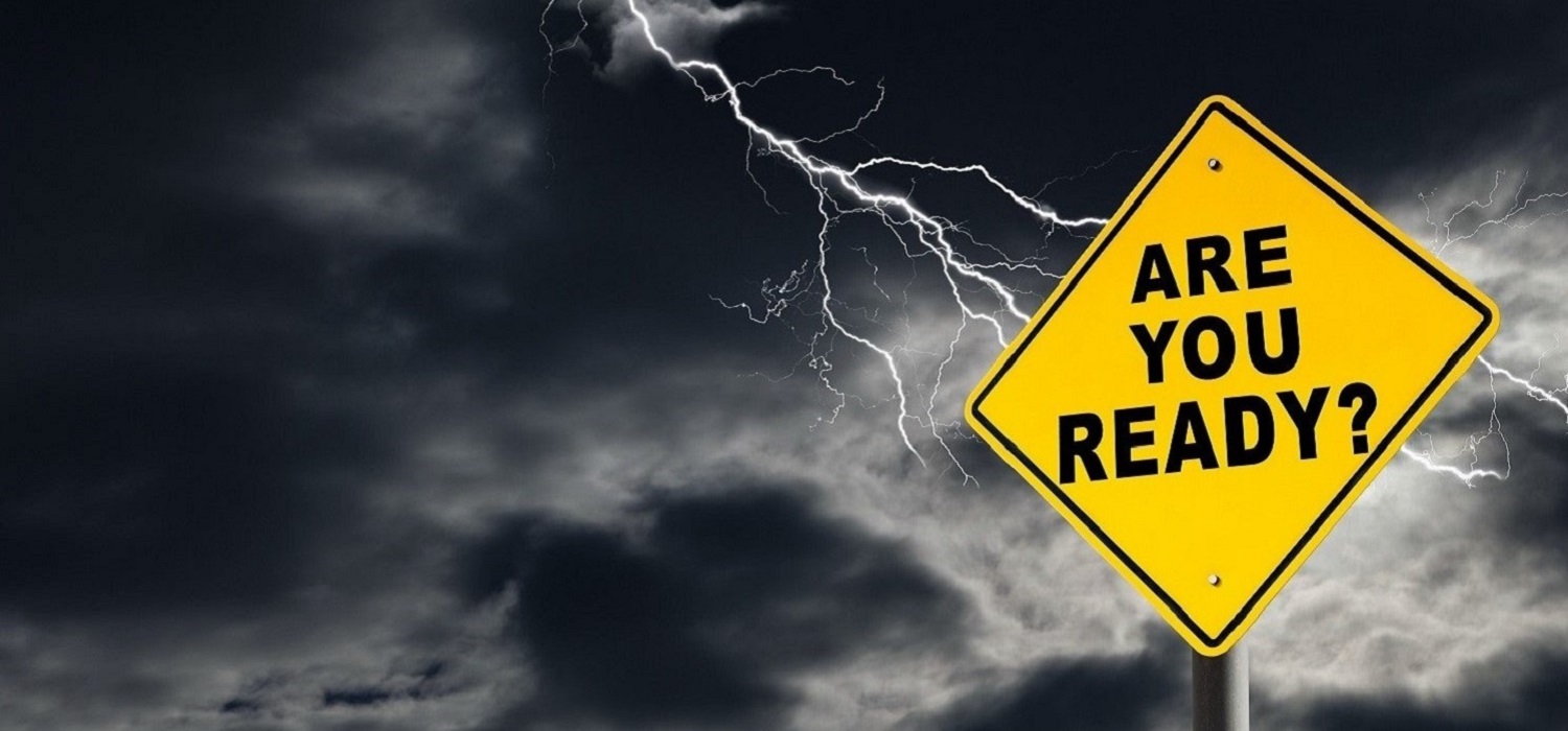 emergency call center services - a caution sign stating "Are You Ready?" with the background of a lightning storm