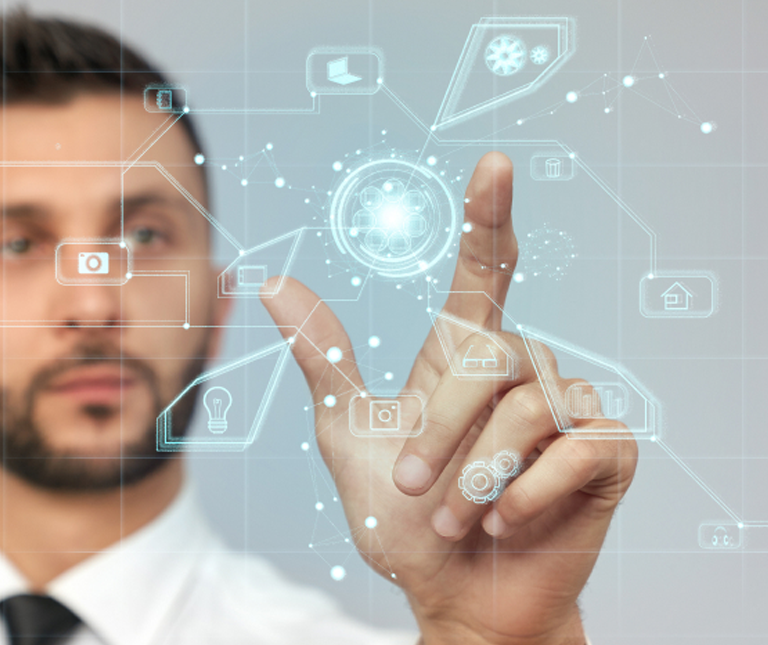 White male with beard with his hand up pointing to an overlay of digital graphics