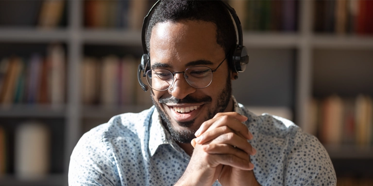man in headset talking to a customer